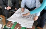 Young couple looking over new house plans