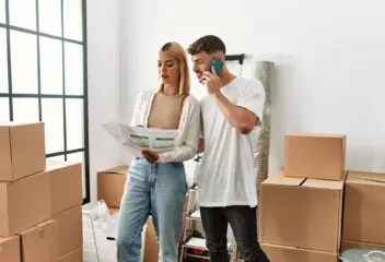 couple looking at snags in newly built home